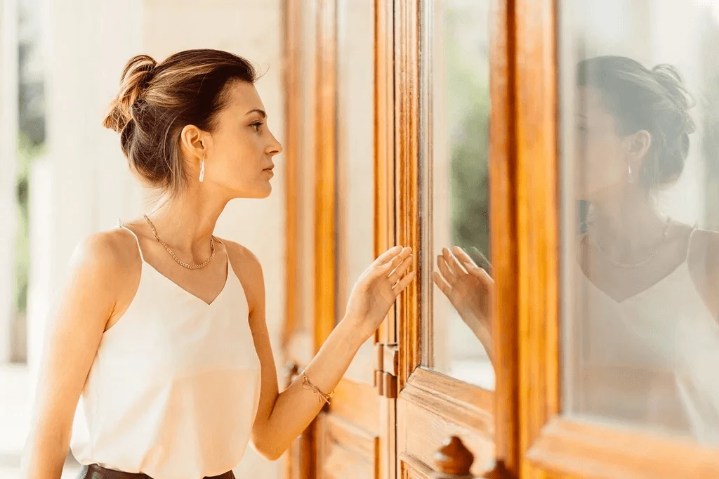 homeowner checking the door of her house