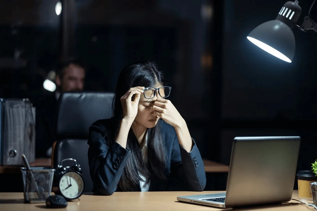 stressed employee due to poor office lighting