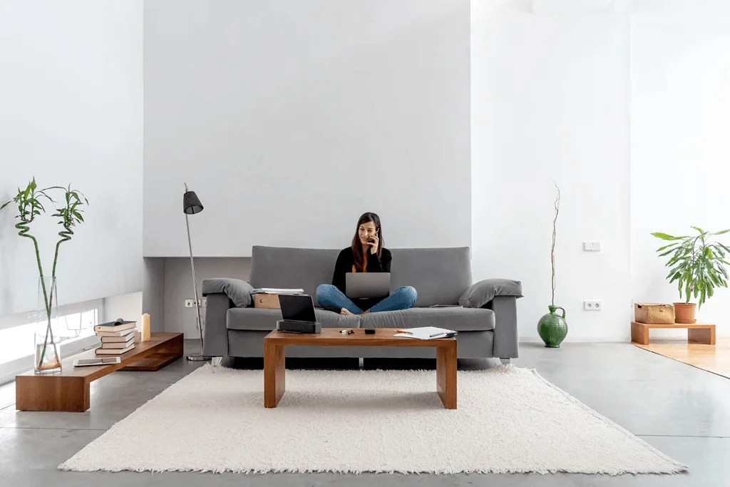 freelancer working in a minimalist living room