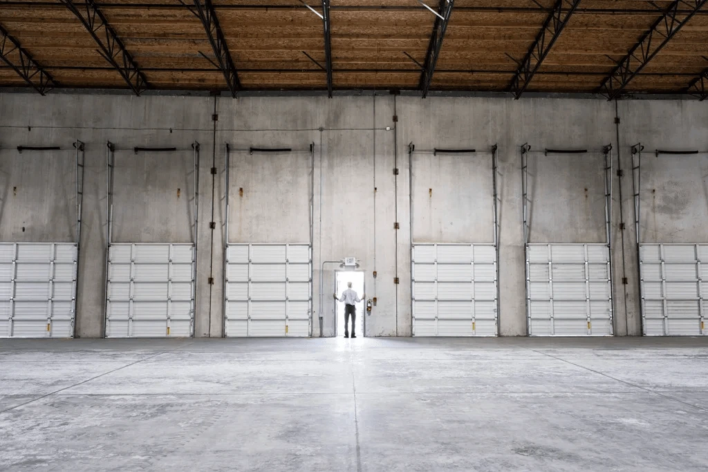 factory worker checking the entrance of the facility