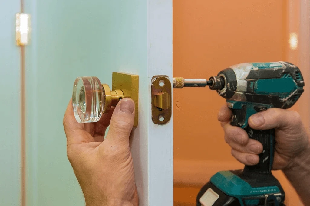 residential owner installing a door knob