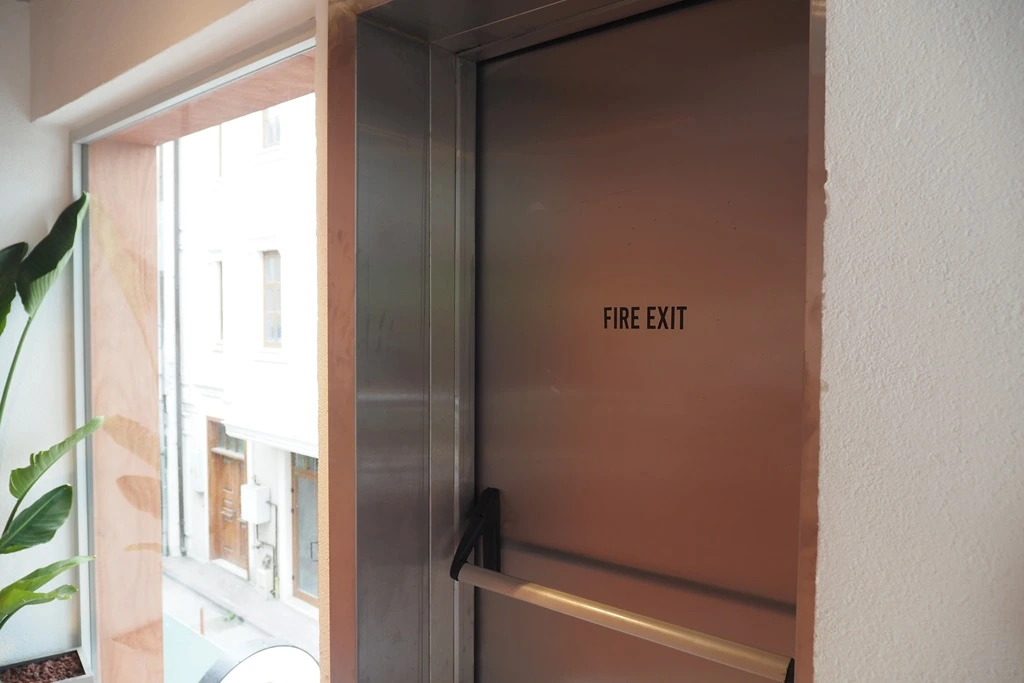 fire exit door dimensions compliance shown with metal push bar door