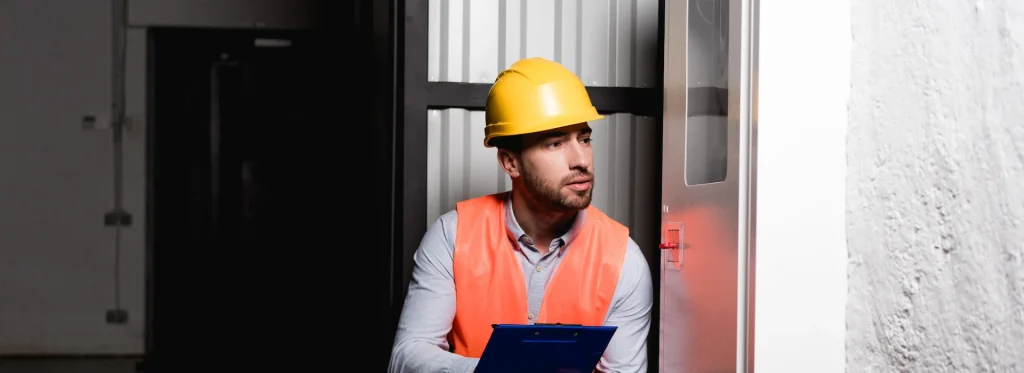 fire door inspector checking doors